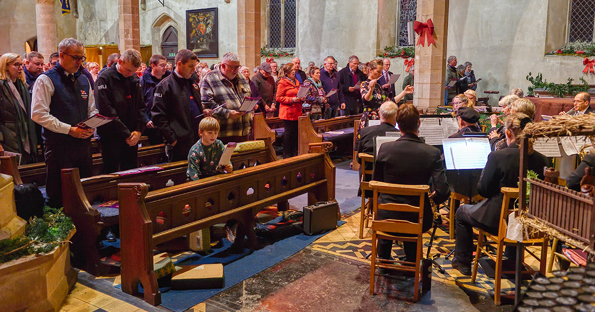 Carol singing filled a Norfolk church to celebrate the bicentenary of the charity that saves lives at sea