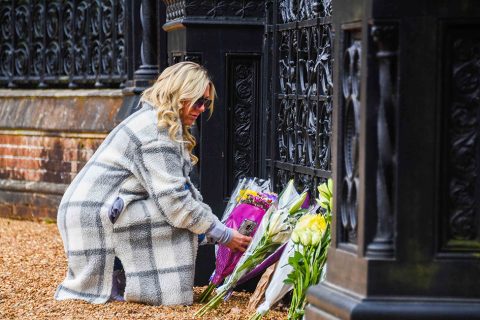 Floral tributes laid by the gates at Sandringham